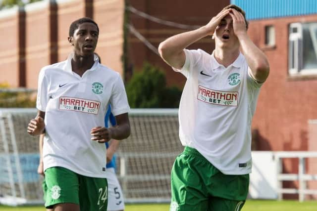 Hibernian's Paul Hanlon (right) shows his frustration after missing a chance. Picture: SNS