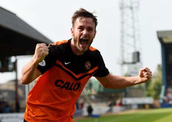 Dundee Utd's Keith Watson celebrates scoring his side's fourth. Picture: SNS
