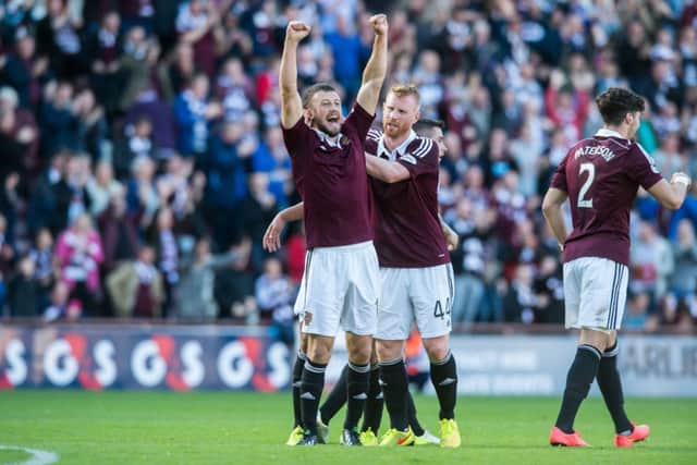 Hearts substitute Dale Carrick, arms aloft, celebrates his second goal against Cowdenbeath. Picture: Ian Georgeson