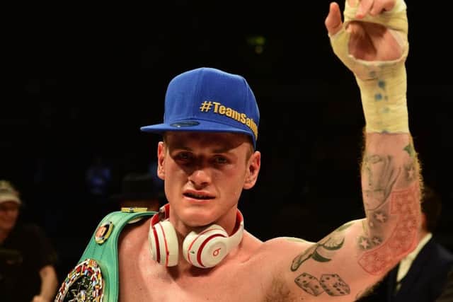 George Groves celebrates victory over Christopher Rebrasse. Picture: PA