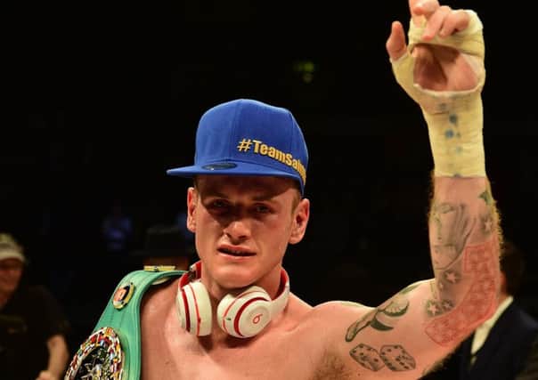 George Groves celebrates victory over Christopher Rebrasse. Picture: PA