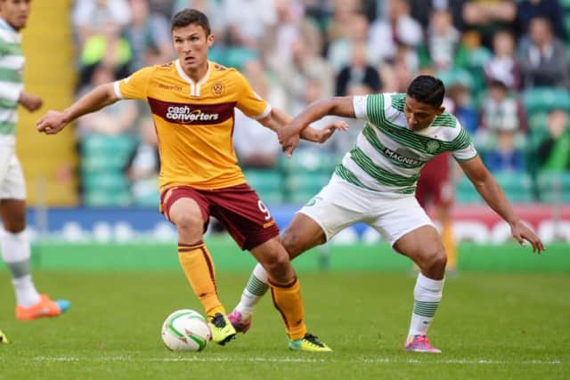 Motherwell's John Sutton (left) battles with Emilio Izaguirre. Picture: SNS