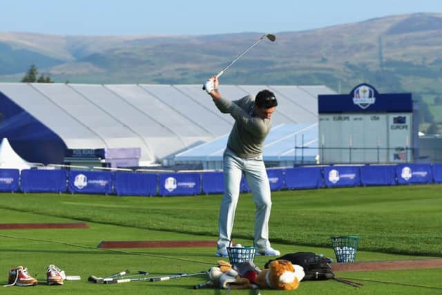 Rory McIlroy got some practice in on the range yesterday as the top golfers arrived at Gleneagles. Picture: Getty
