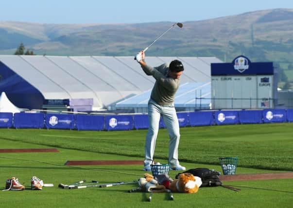 Rory McIlroy got some practice in on the range yesterday as the top golfers arrived at Gleneagles. Picture: Getty