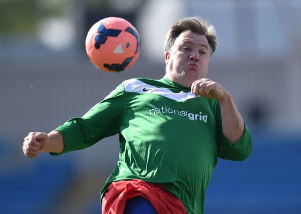 Shadow chancellor Ed Balls controls the ball during a football match between Labour Party MPs and journalists. Picture: Getty