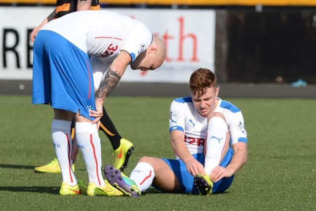 Rangers Lewis Macleod went over on his ankle and hurt his foot on the 3G surface at Alloa. Picture: SNS
