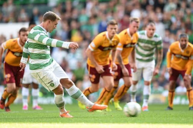 Kris Commons slots home his side's equalising goal from the penalty spot. Picture: SNS