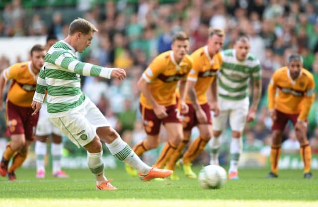 Kris Commons slots home his side's equalising goal from the penalty spot. Picture: SNS