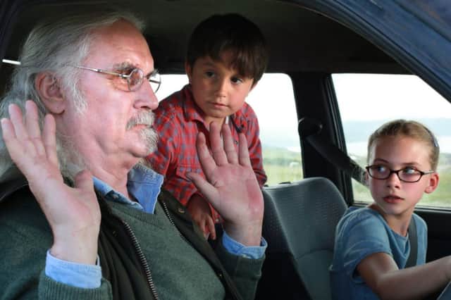 Billy Connolly as Gordie in What We Did On Our Holiday, with his screen grandchildren Lottie and Mickey