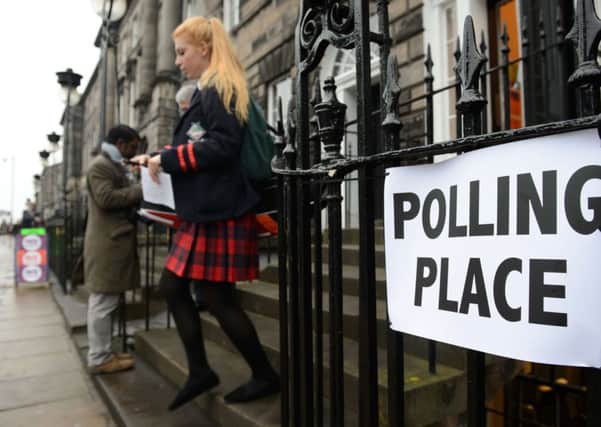 A young voter leaves a polling station after casting her vote in Edinburgh last Thursday. Picture: Getty