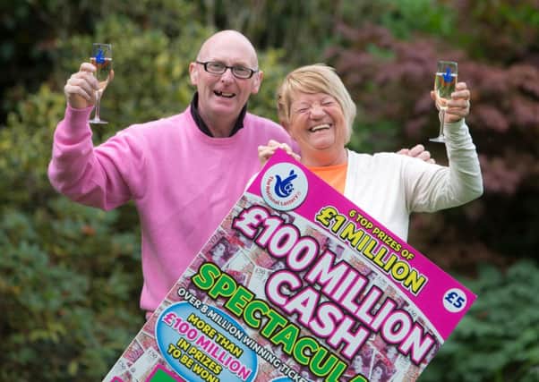 Grace and William Walker celebrating winning £1 million. Picture: PA