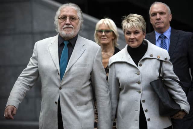 Former radio and TV presenter Dave Lee Travis  arrives with his wife Marianne Griffin at Southwark Crown Court in central London. Picture: Getty