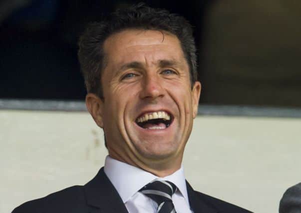 John Collins takes in the Hearts-Cowdenbeath match. Picture: SNS