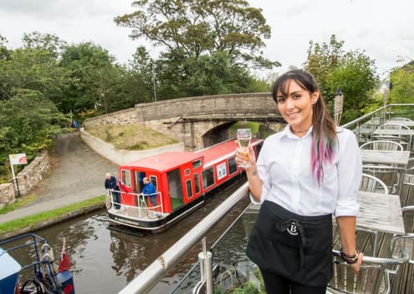 The Bridge Inn has been named the best pub in Scotland. Jackie Smith, one of the bar staff, is pictured. Picture: Ian Georgeson