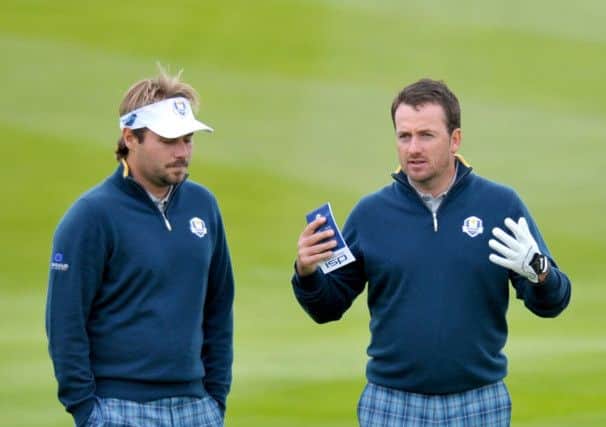 Ryder Cup rookie Victor Dubuisson, left, and European team-mate Graeme McDowell chat at Gleneagles. Picture: Jane Barlow