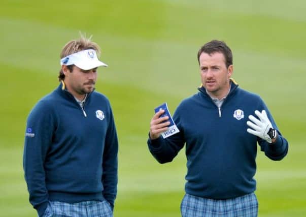 Ryder Cup rookie Victor Dubuisson, left, and European team-mate Graeme McDowell chat at Gleneagles. Picture: Jane Barlow