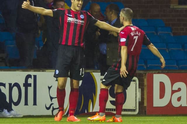Brian Graham (left) celebrates after giving his side the lead. Picture: SNS