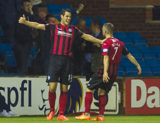 Brian Graham (left) celebrates after giving his side the lead. Picture: SNS
