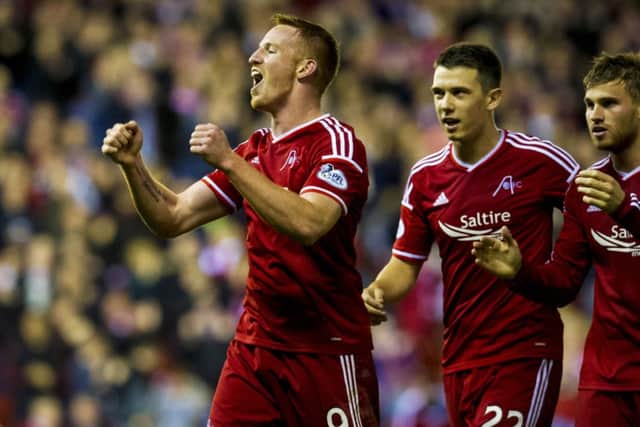 Aberdeen's Adam Rooney (left) celebrates with team-mates. Picture: SNS