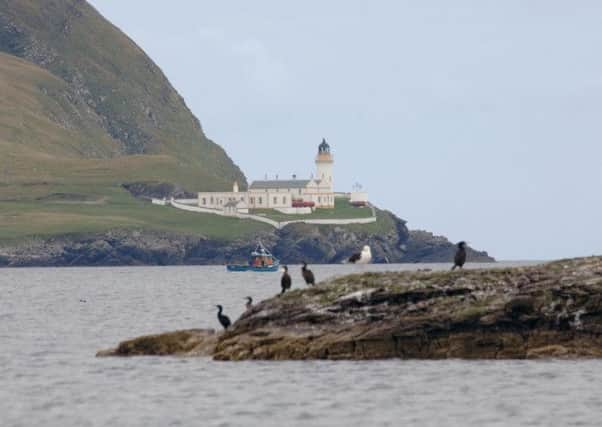Niall Stuart, chief executive of Scottish Renewables, said the two governments must commit to getting Shetland (pictured), Orkney and the Western Isles connected by 2020. Picture: PA