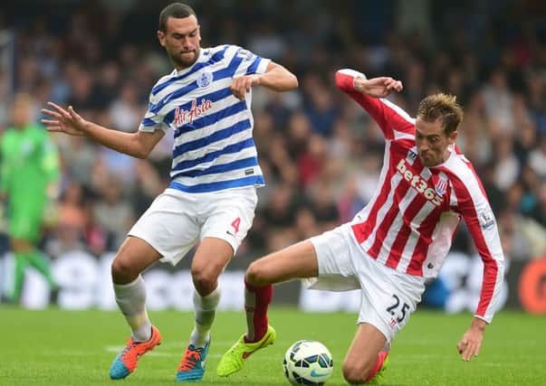Steven Caulker (left) battles with Stoke's Peter Crouch. Picture: PA