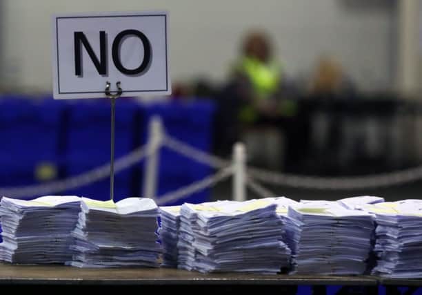 'No' ballots stacked up on a table at Ingliston during the Scottish independence vote count. Picture: AP