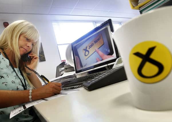 SNP employee Claire Bennett processes membership forms at the party's headquarters in Edinburgh. Picture: PA