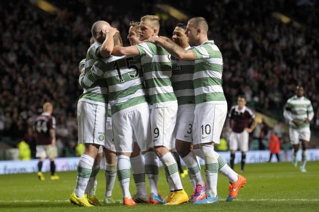Celtic celebrate Kris Commons scoring from the penalty spot. Picture: John Devlin
