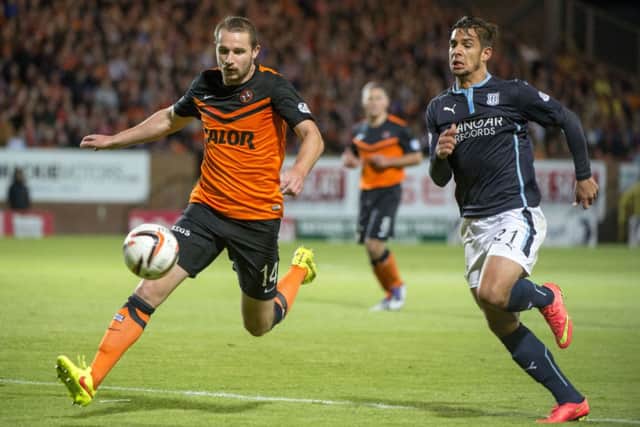 Dundee's Luka Tankulic (right) challenges Callum Morris. Picture: SNS