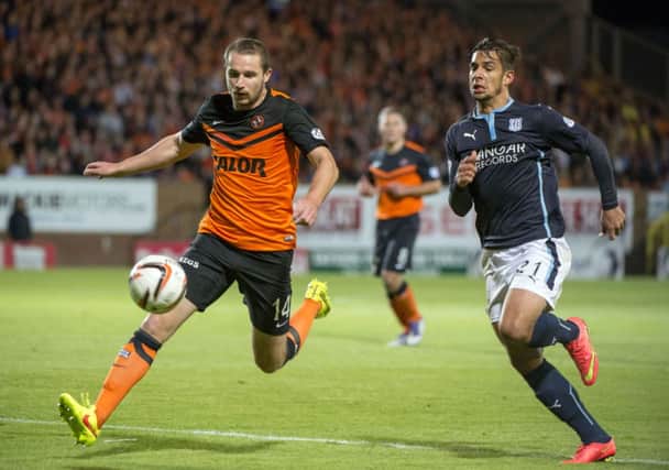 Dundee's Luka Tankulic (right) challenges Callum Morris. Picture: SNS