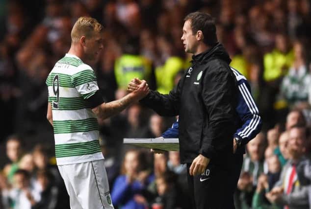 Celtic manager Ronny Deila congratulates goal scorer John Guidetti (left) as he comes off. Picture: SNS