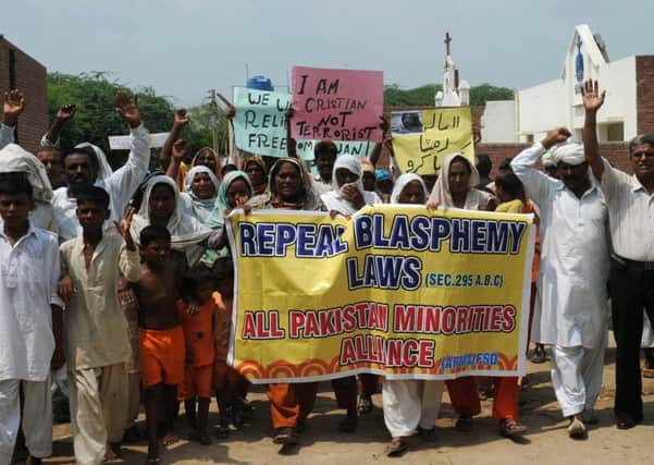 Christian Pakistanis protest the country's blasphemy laws. Scot Mohammad Ashgar is currently in prison after being convicted of the crime. Picture: Getty