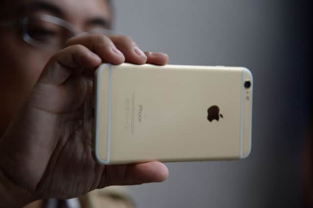 Man checks out his iPhone 6 Plus outside Apple store in Pasadena. Picture: AFP