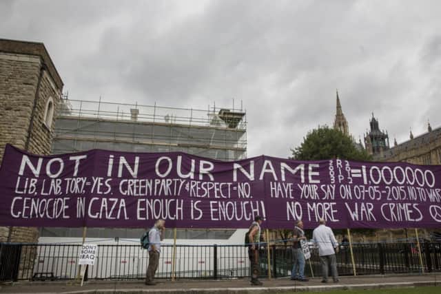 A  group of protesters gather  Houses of Parliament. Picture: Getty