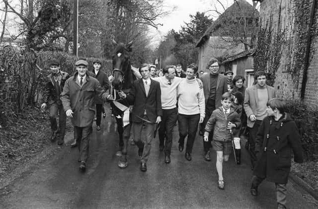 Trainer Toby Balding walks with Highland Wedding the day after the 1969 Grand National. Picture: PA