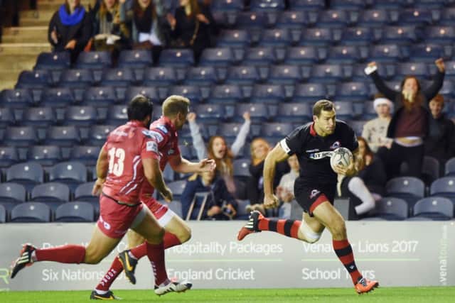 Tim Visser runs in to score his sides first try during last nights draw with Scarlets at Murrayfield.  Picture: SNS