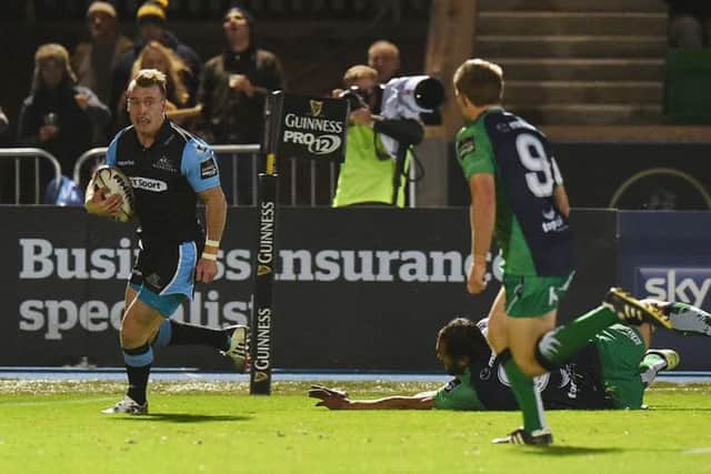 Glasgows Stuart Hogg crosses the line at Scotstoun to score his second try of the night. Picture: SNS