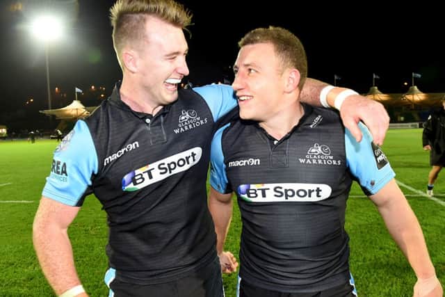 Warriors pair Stuart Hogg (left) and Duncan Weir celebrate at full-time. Picture: SNS