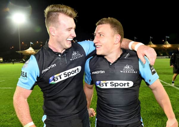 Warriors pair Stuart Hogg (left) and Duncan Weir celebrate at full-time. Picture: SNS