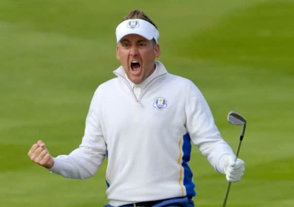 A rejuvenated Ian Poulter celebrates his stunning chip on the 15th which helped to rescue his fourball match for Europe Photograph: Jane Barlow