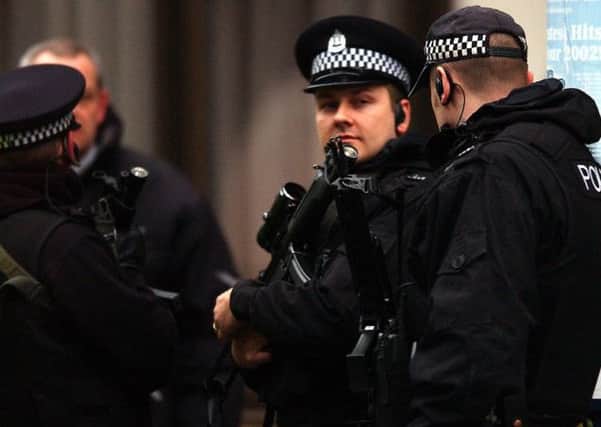 Arming police on routine patrols is under review by the Scottish Police Authority. Photograph: Ian Rutherford