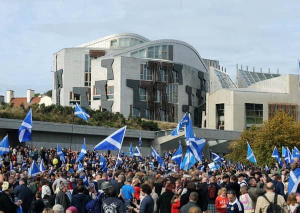 Pro-independence supporters gather outside the Scottish Parliament. Picture: Lisa Ferguson