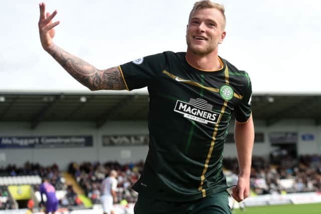 John Guidetti celebrates after scoring his and Celtic's second. Picture: SNS