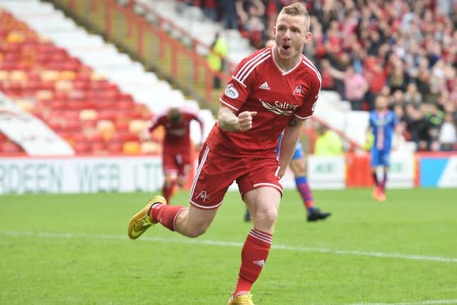 Jonny Hayes wheels away after scoring what turned out to be the winner. Picture: SNS