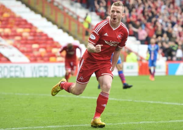 Jonny Hayes wheels away after scoring what turned out to be the winner. Picture: SNS