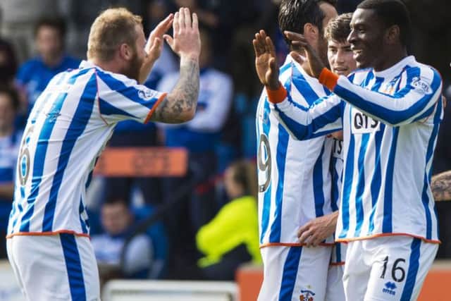 Tope Obadeyi is congratulated by his team-mates after putting Kilmarnock in front. Picture: SNS