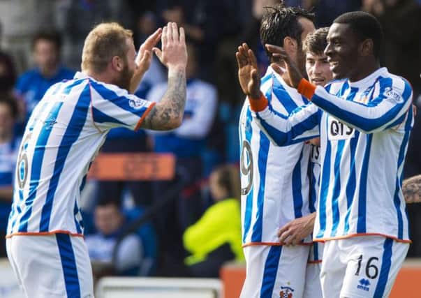 Tope Obadeyi is congratulated by his team-mates after putting Kilmarnock in front. Picture: SNS