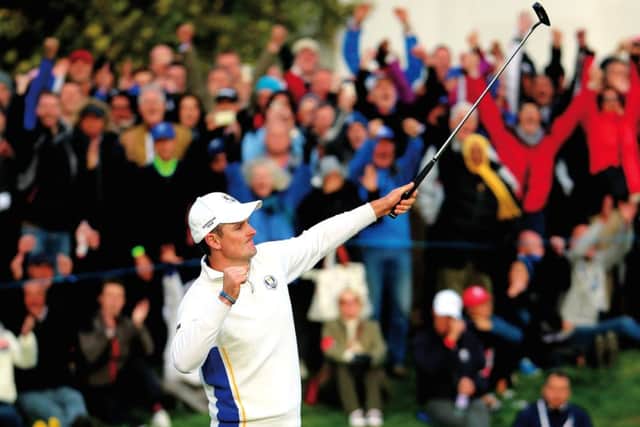 Justin Rose celebrates as he halves his match on the 18th green during the Afternoon Foursomes of the 2014 Ryder Cup. Picture: Getty