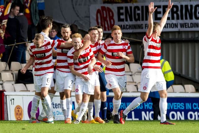 Ali Crawford celebrates his second goal alongside his Hamilton teammates. Picture: SNS