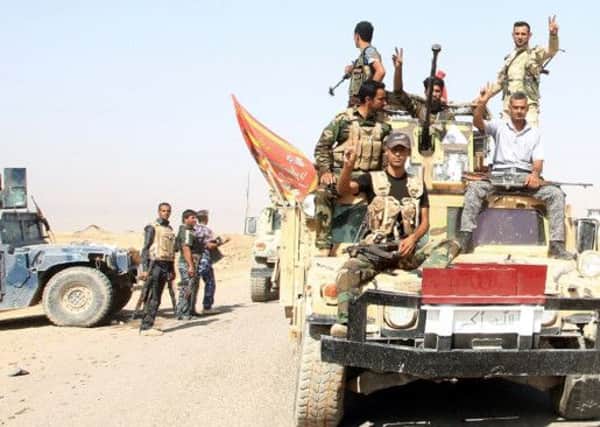 Iraqi forces arrive in the town of Amerli to deliver assistance to the Shiite Turkmen-majority town after they broke a months-long jihadist siege. Picture: Getty
